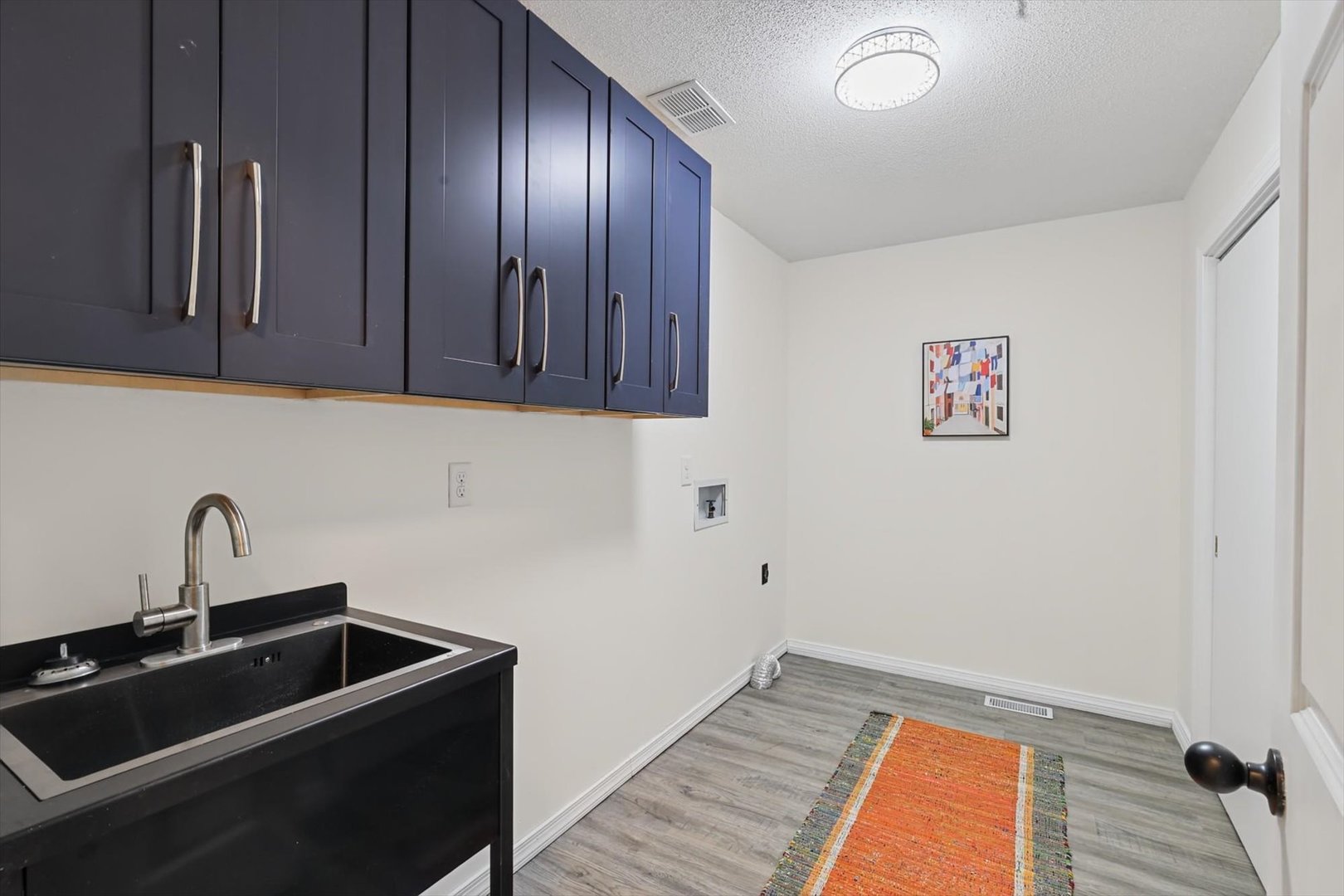 Off hallway between family room, garage, and 1st f