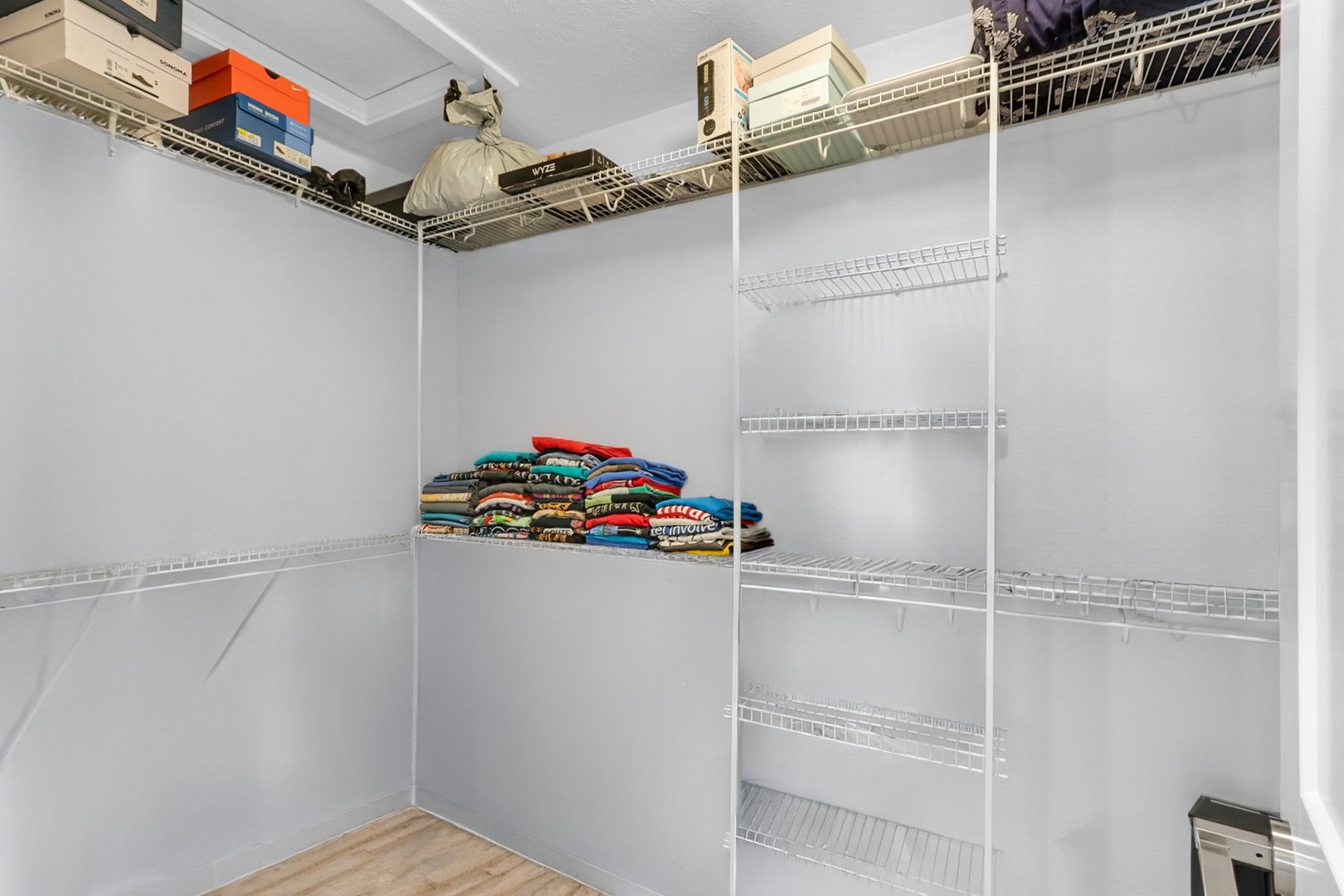 Primary bedroom walk-in closet