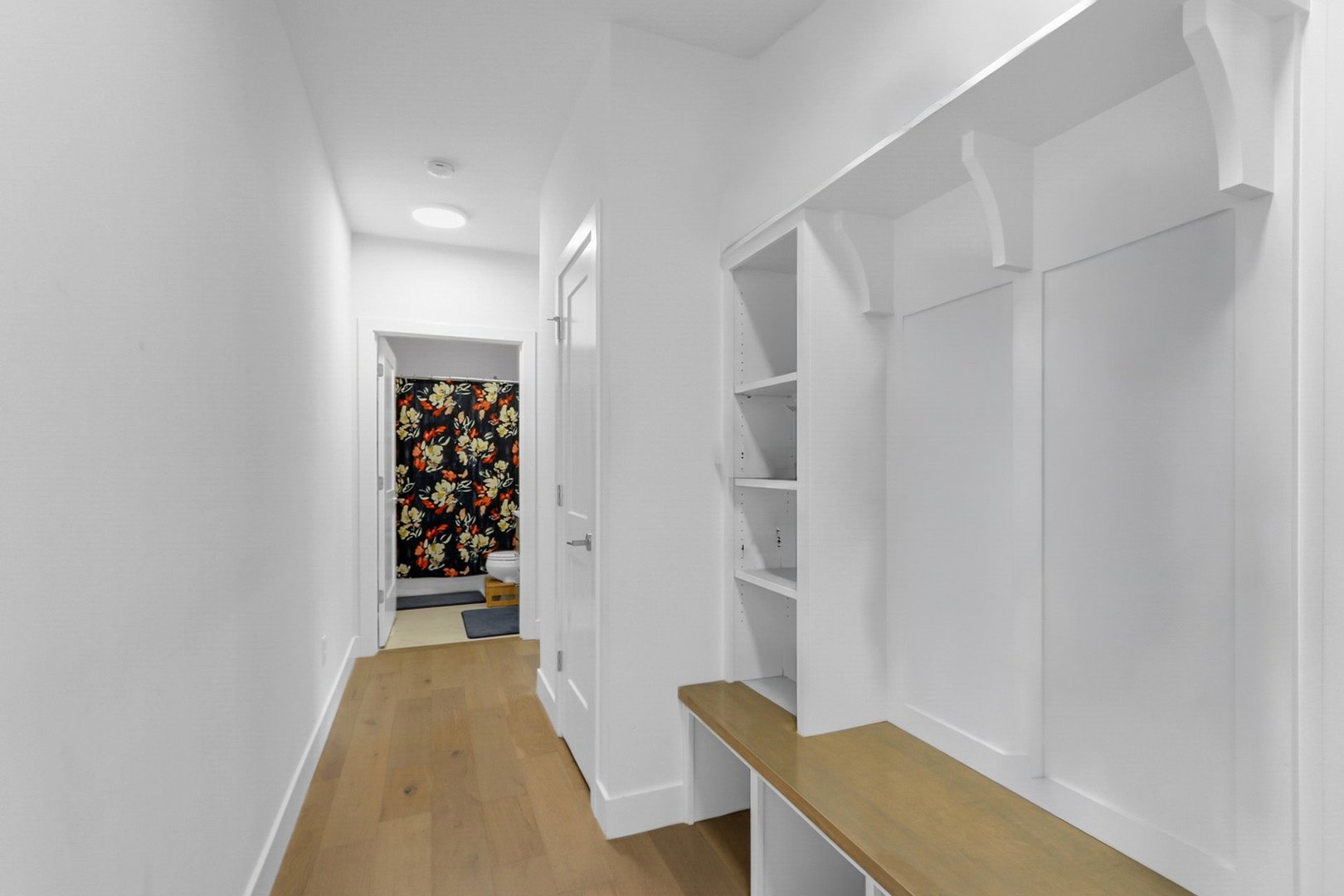Drop zone and hallway to main level bedroom & full