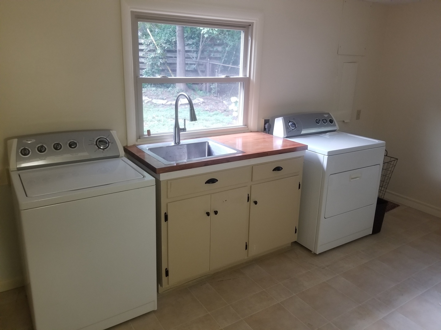 Oversized Laundry Room with utility sink for washi