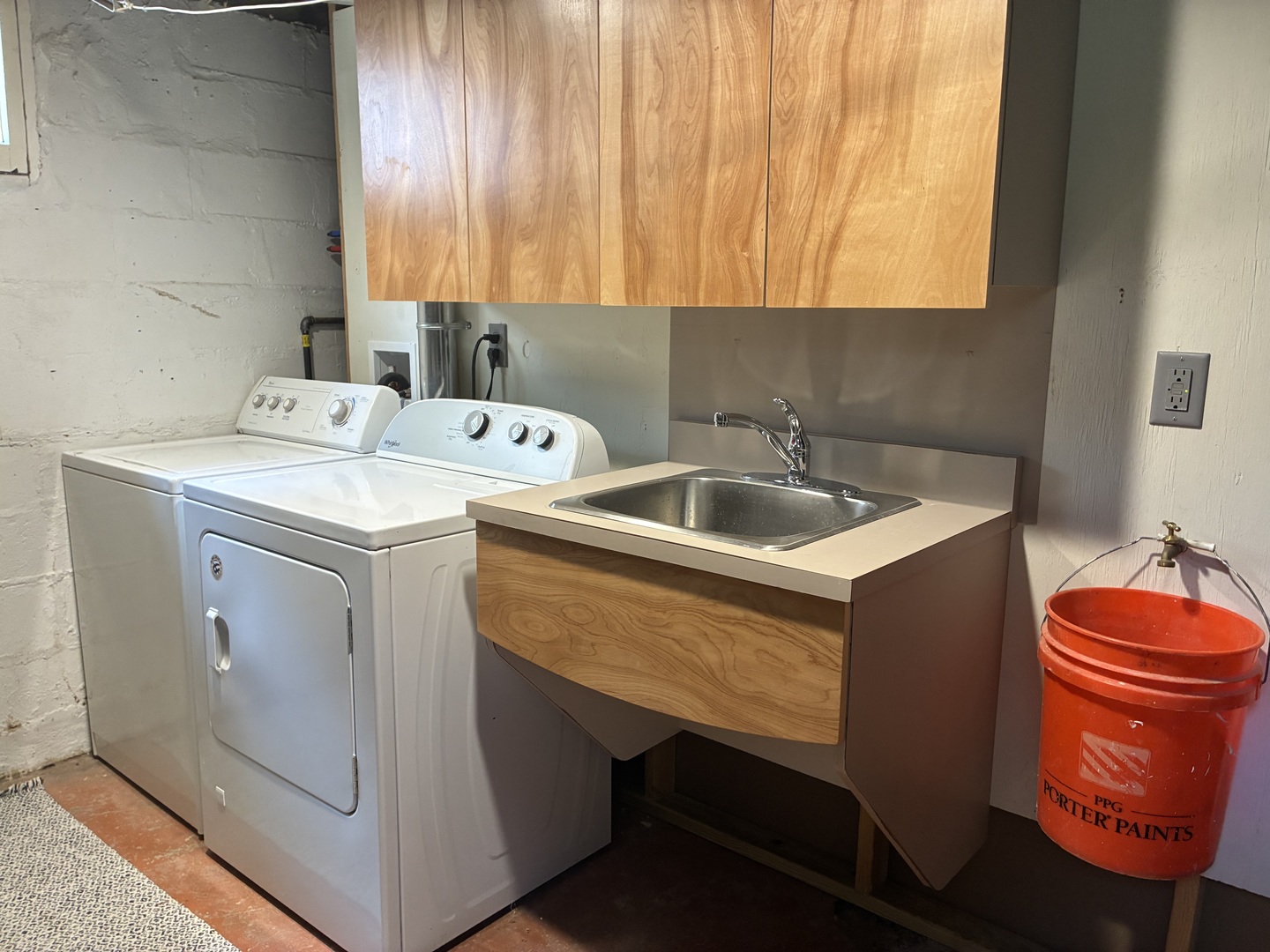 Laundry complete with utility sink and handy bucke